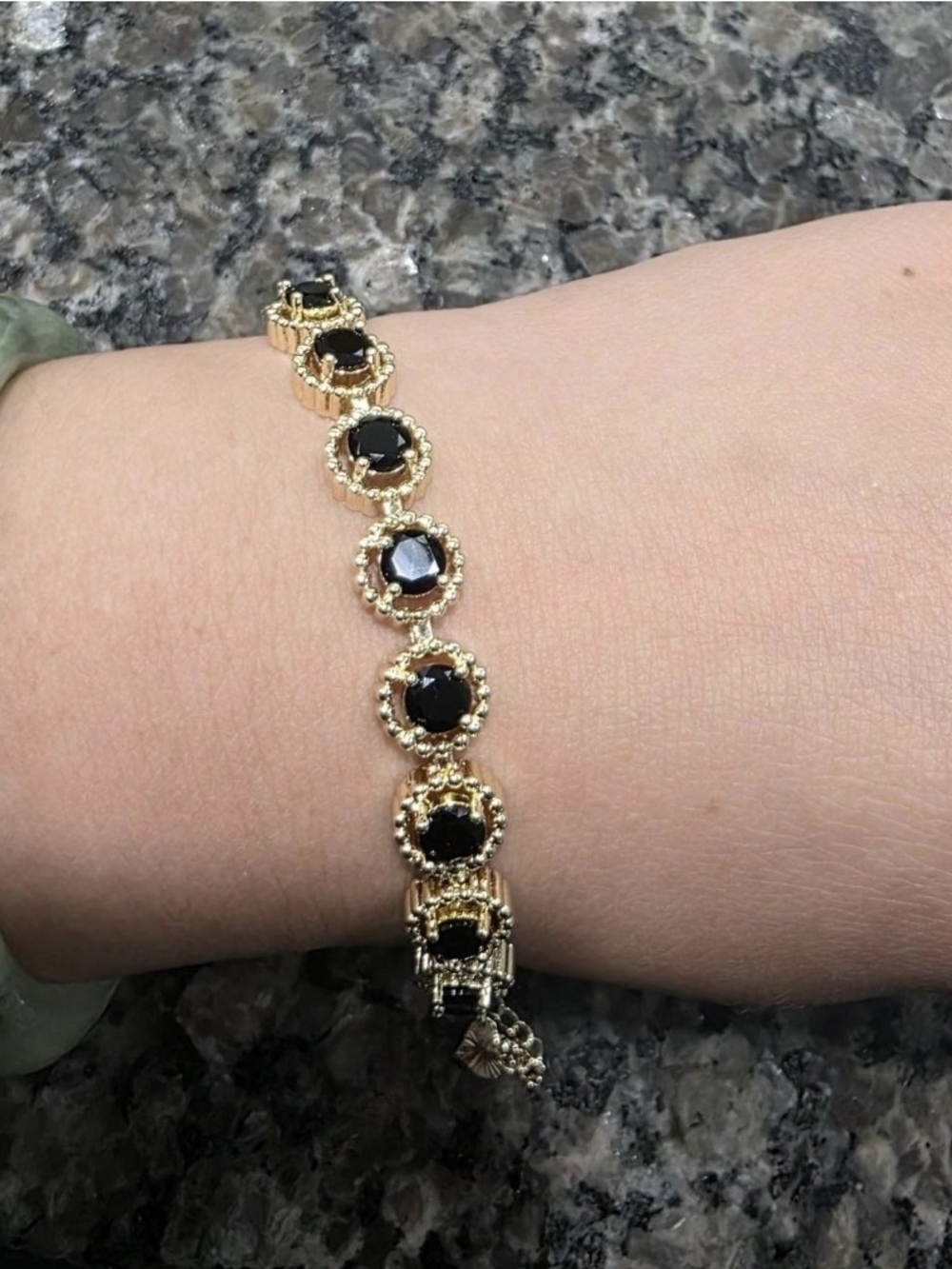 Gold Tone Bracelet with Black Gem Accents